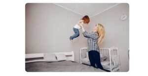 When to move crib mattress down